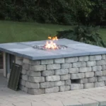 HPC ready-to-finish fire pit enclosure with paver stone cladding with access for gas 20 lb lp bottle