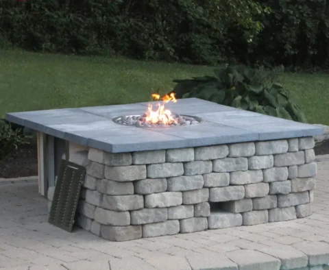 HPC ready-to-finish fire pit enclosure with paver stone cladding with access for gas 20 lb lp bottle