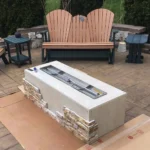 Cladding phase of the HPC Ready-to-Finish Fire Pit Enclosure during a fire pit build