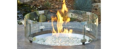 Round Fire Pit Wind Guard on a lit fire pit with Clear Fire Glass