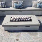 White Ceramic Fire Balls in a Fire Pit with seating in an outdoor area
