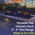 XXL Lava Rock - 3" to 6" pieces on a bed of medium sized lava rock in a lit fire pit