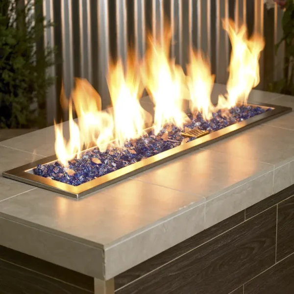 1/2 Inch Classic Fire Glass in Cobalt Blue in a lit fire pit