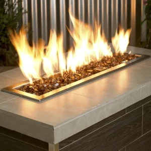 1/2 Inch Classic Fire Glass in Copper in a lit fire pit