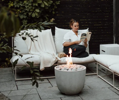 Element fire pit in a cozy garden setting
