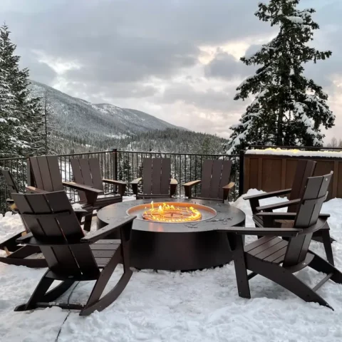 Unity Fire Pit in a backyard with snowy mountain views