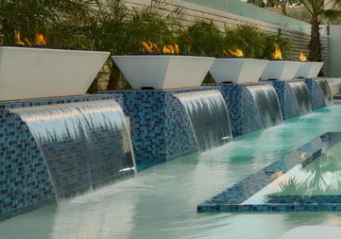 Linear Maya Fire Bowls installed as a poolside fire feature