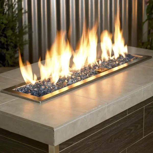 1/2 Inch Pacific Blue Fire Glass in a lit fire pit