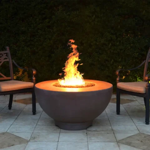 Sienna Fire Pit - GFRC Concrete in a patio setting at night