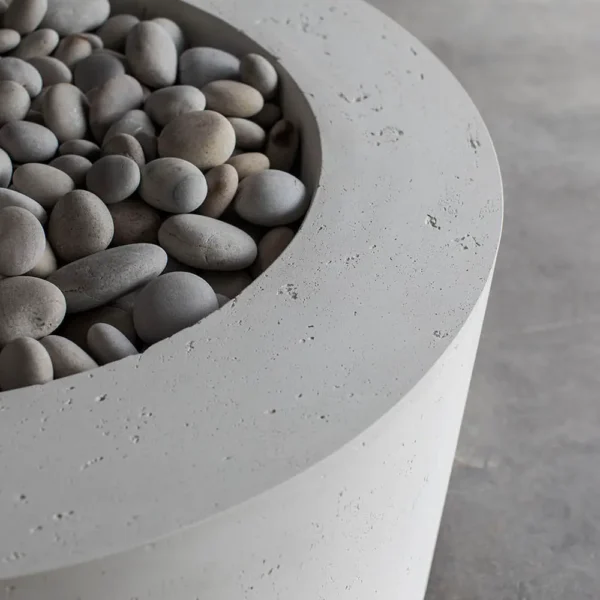 lightweight concrete belmont fire pit with slate beachstone fire media close up