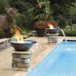 Hammered copper Tempe Fire & Water Bowl poolside